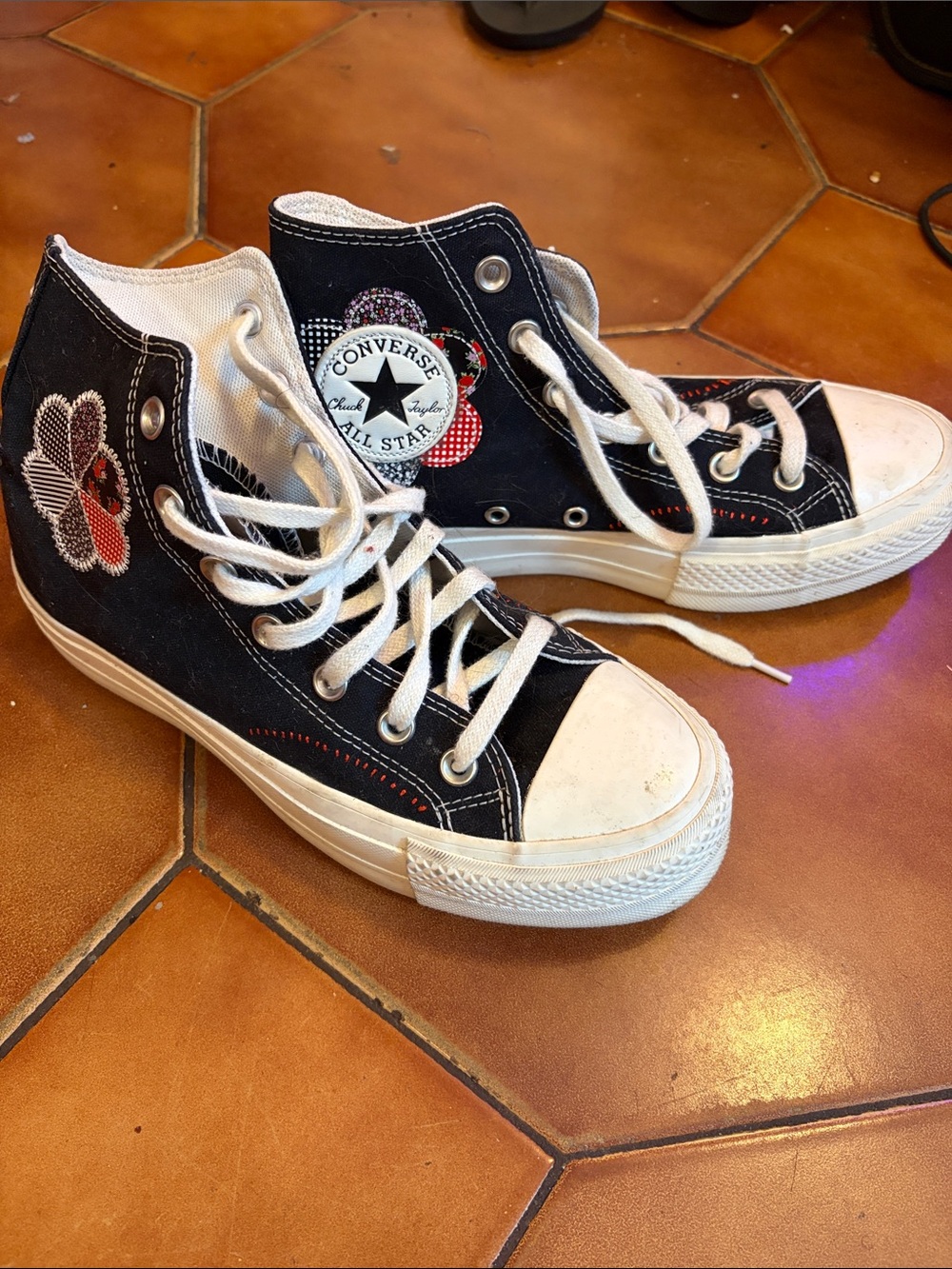 Converse Black High-Top Sneakers with White Accents and Floral Patch